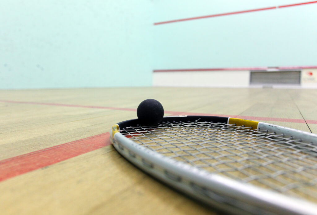 Squash court and racket with ball